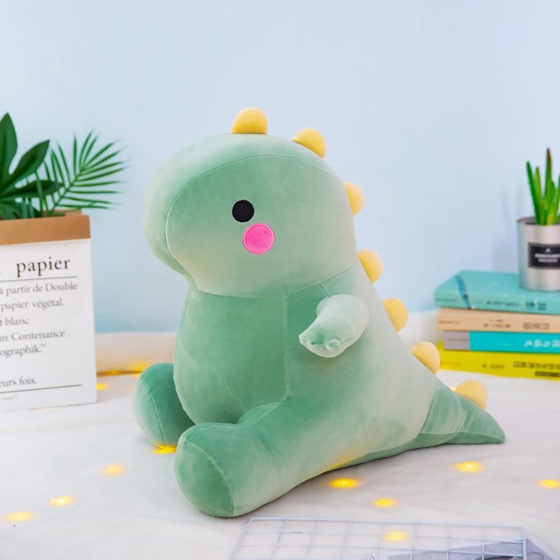 La peluche bébé dinosaure